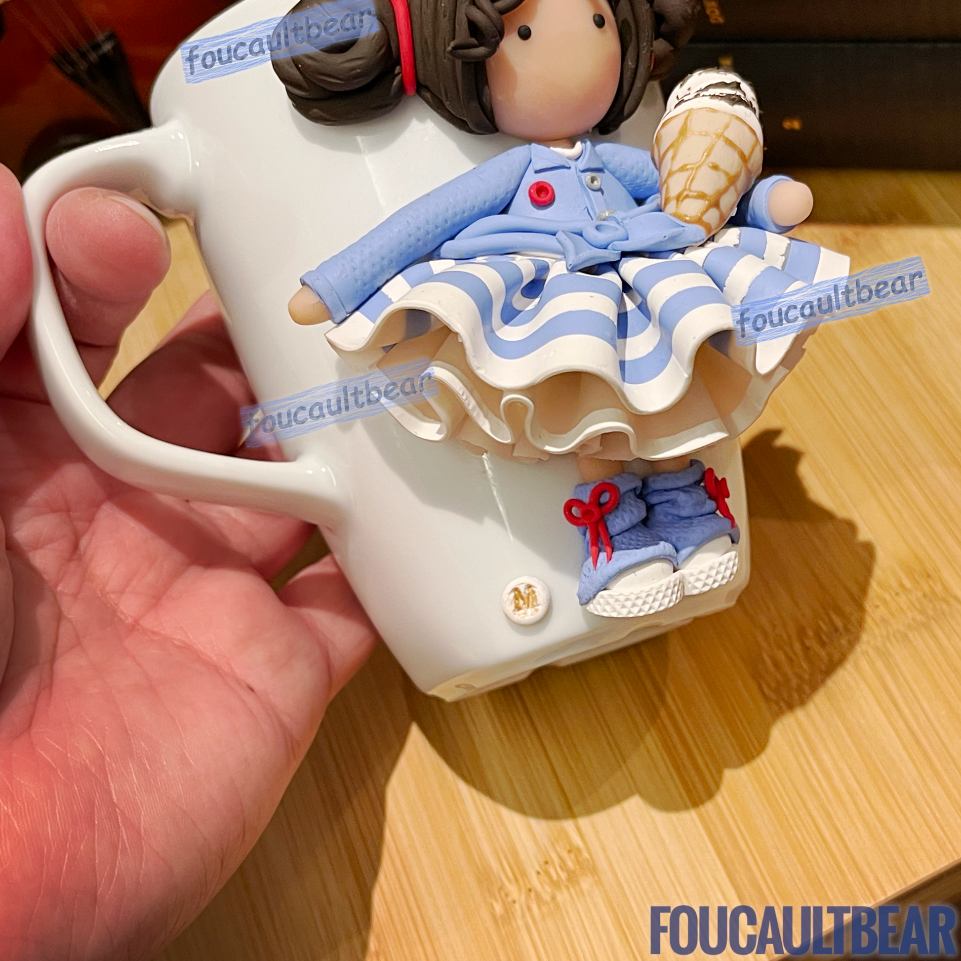 Beautifully adorned with Foucaultbear's clay art figurines, these porcelain cups and mugs will brighten your day everyday.