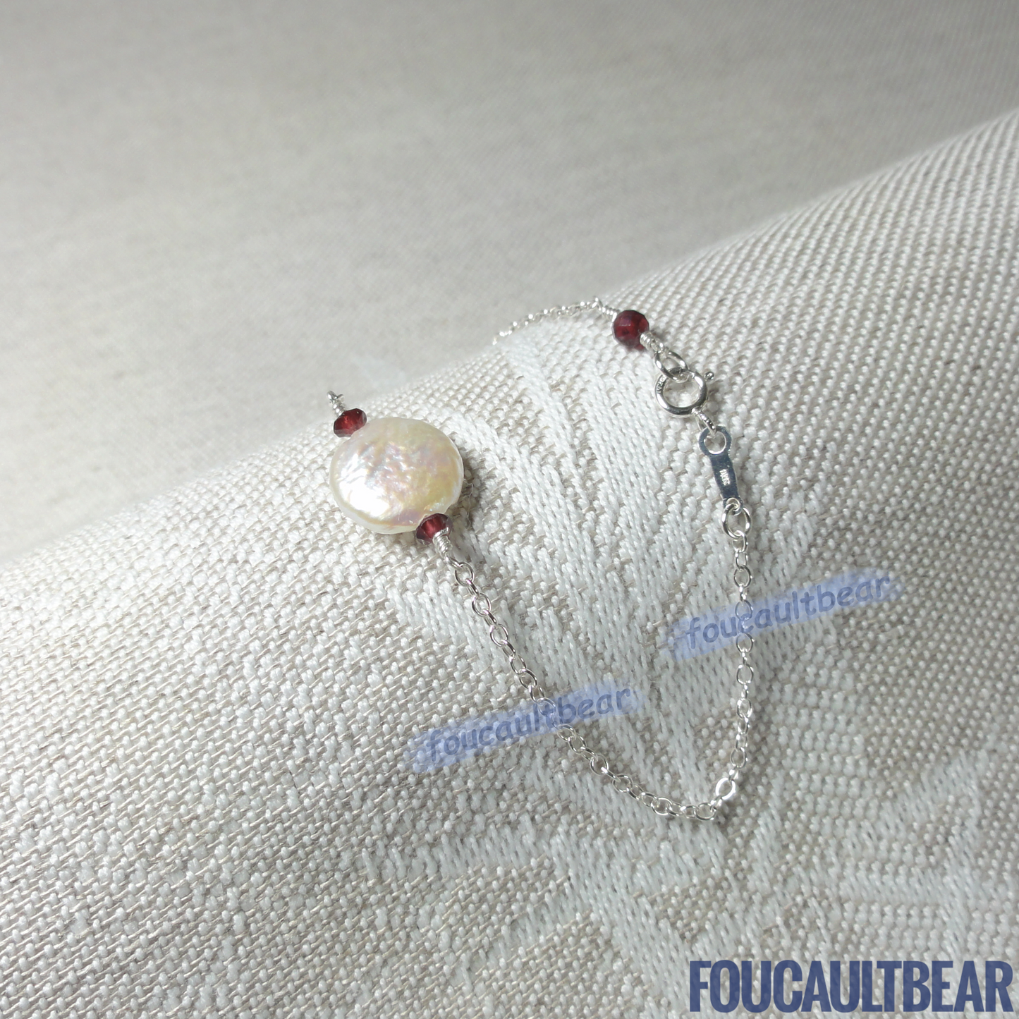 Foucaultbear's HANDCRAFTED BRACELET. Natural Freshwater Coin Pearl & Natural Red Garnets. All 925 Sterling Silver Components. Custom Lengths Available. This 925 Sterling Silver 11-12mm Natural Freshwater Coin Pearl and Natural Earth-Mined Red Garnets Bracelet makes for a great daily wardrobe staple. Makes for a wonderful wedding party or bridesmaid gift too. This freshwater coin pearl has natural striations, iridescent rainbow hues showing its unique characteristics.