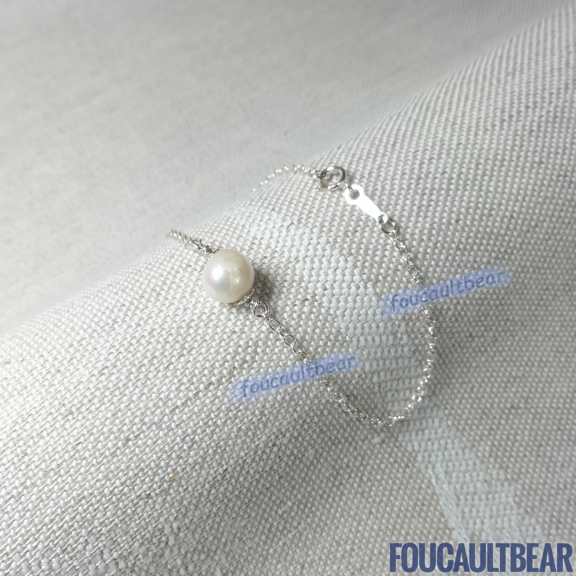 Foucaultbear's HANDCRAFTED BRACELET. Natural Freshwater Pearl (7-8mm near-round). All 925 Sterling Silver Components. Custom Lengths Available. This Natural Freshwater Pearl (7-8mm near-round), 925 Sterling Silver bracelet is simplicity at its best! Makes for a great daily wardrobe staple, as well as Just-Because and Occasion gift. Makes for a wonderful wedding party or bridesmaid gift too. This freshwater pearl has natural spots (not completely smooth) with good luster showing its unique characteristics. 