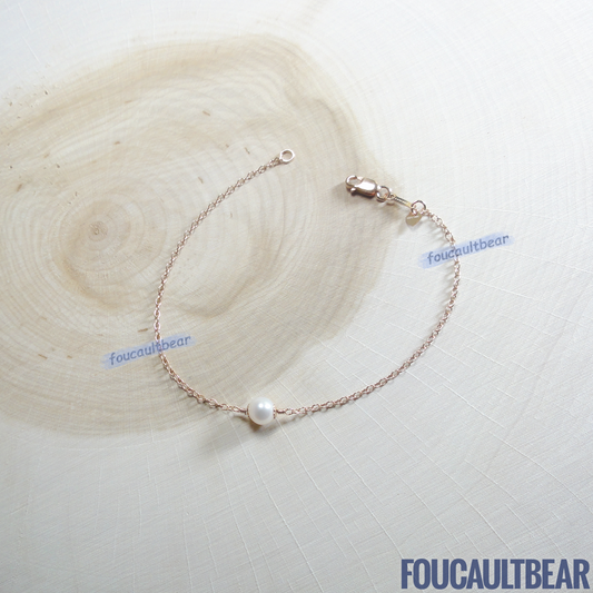 Foucaultbear's HANDCRAFTED BRACELET. 6mm Near-Round Freshwater Pearl with 14kt Rose-Gold-Filled Heart Charm. All 14kt Rose-Gold-Filled Components. Custom Lengths Available. Natural Freshwater Pearl (6mm Near-Round) with 14kt Gold-Filled Heart Charm & Bracelet adds simplicity yet exudes subtle elegance to your wardrobe. This fine near-round pearl is iridescent and has good luster. Can be worn on casual days and holds up well for dressed-up evenings. Perfect gift for your wedding party or bridesmaids too. 