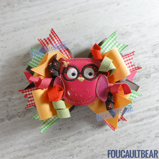 Foucaultbear's HANDMADE MULTI-LAYERED HAIR BOW CLIP with CENTERPIECE. Large Fall Homecoming Brainy Owl with Glasses. Soft Patent Centerpiece. Grosgrain Ribbon Bow. French Barrette Hair Clip For Ponytail or Pigtails. M2MG. Adorable Soft Big Bespectacled Owl is perfect for toddlers, preschoolers, kindergartners, elementary or even middle-schoolers for the coming Autumn and Thanksgiving. Can be worn year round too for owl lovers! Very versatile in my opinion. 