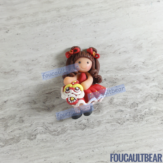 Foucaultbear's HANDMADE CLAY ART FLATBACK. Lunar Chinese New Year Girl (Brunette) with Lion (Small). Handmade Polymer Clay Art. For Your Own Creative Use, such as on Hair Bow Barrette Clips, Picture Frames and Refrigerator Magnets. This small sized flatback clay Lunar Chinese New Year Girl (Brunette) with Lion looks good as a hair centerpiece. Great for any of your art projects, too.