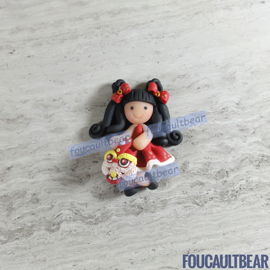 Foucaultbear's HANDMADE CLAY ART FLATBACK. Lunar Chinese New Year Girl (Black Hair) with Lion (Small). Handmade Polymer Clay Art. For Your Own Creative Use, such as on Hair Bow Barrette Clips, Picture Frames and Refrigerator Magnets. This small sized flatback clay Lunar Chinese New Year Girl (Black Hair) with Lion looks good as a hair centerpiece. Great for any of your art projects, too.