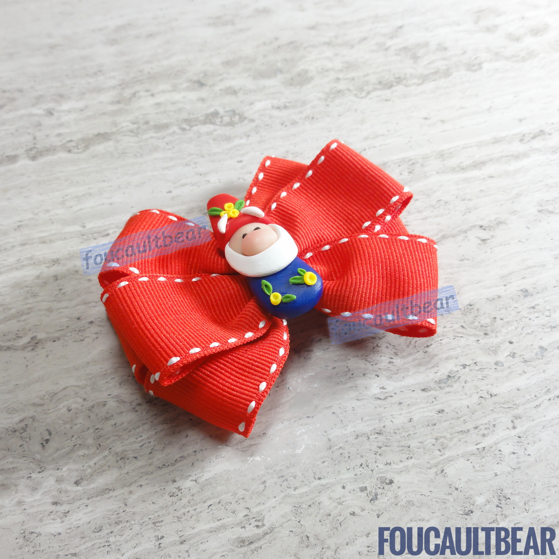 Foucaultbear's HANDMADE MULTI-LAYERED HAIR BOW CLIP with CLAY CENTERPIECE. Garden Gnome in Festive Red & Blue. Handmade Polymer Clay Centerpiece. Grosgrain Ribbon. French Barrette Hair Bow for Ponytail & Pigtails. Adorable Garden/Holiday Gnome centerpiece adorns this hair bow barrette. Perfect for toddlers, preschoolers, kindergartners, elementary or even middle-schoolers for the coming holiday season. Suitable for year-round wearing too. 