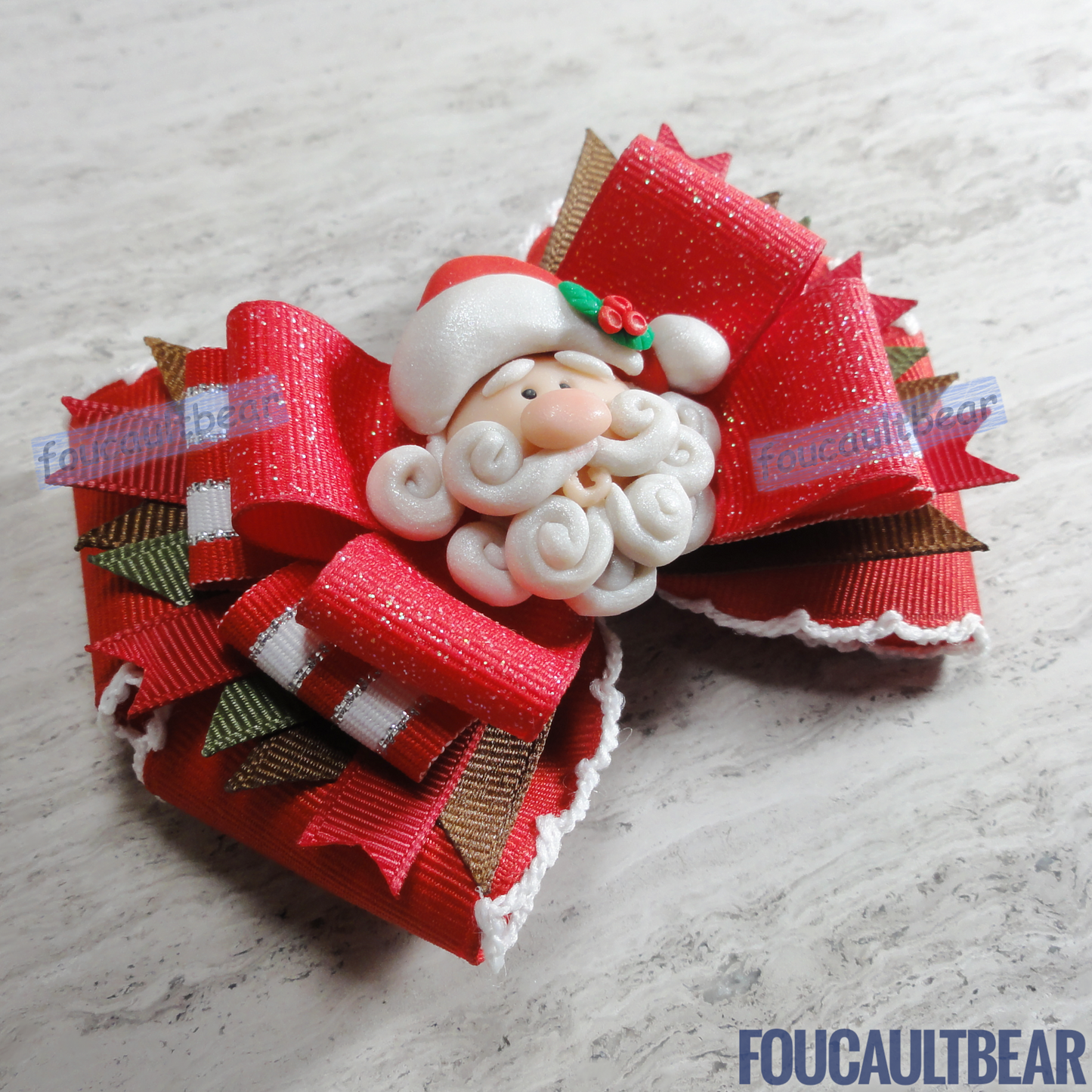 Foucaultbear's HANDMADE MULTI-LAYERED HAIR BOW CLIP with CLAY CENTERPIECE. Jolly Santa Claus with White Trim. Handmade Polymer Clay Centerpiece. Grosgrain Ribbon. French Barrette Hair Bow for Ponytail & Pigtails. Jolly Father Santa Claus with White Trim centerpiece adorns this hair bow barrette. Perfect for toddlers, preschoolers, kindergartners, elementary or even middle-schoolers for the coming Christmas holiday season. Looks great on adults too! 