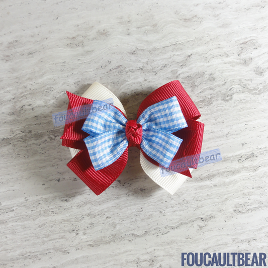 Foucaultbear's HANDMADE MULTI-LAYERED HAIR BOW CLIP. Dorothy Bow, Deep Red on Old-Time White. Grosgrain Ribbon. Partially Lined Alligator Hair Clip. A timeless Dorothy hair bow perfect for toddlers, preschoolers, kindergartners or elementary-schoolers year-round. Very versatile, in my opinion. Approximately 3 inches (7.6 cm) in length and 2 1/4 inches (5.7 cm) at its widest. These measurements are approximate. As this bow is handmade to order, please allow very slight variations in measurement. 