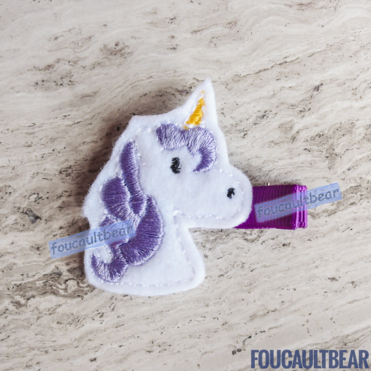 Foucaultbear's HANDMADE HAIR CLIPPIE. Lavender Unicorn. Embroidered Soft Felt Centerpiece. Partially Lined Alligator Hair Clip. Cute Lavender Unicorn Hair Clippie. Every little girl will fall in love with unicorns at some point in their young life.  Perfect for toddlers, preschoolers, elementary-schoolers Absolutely adorable on babies with enough hair to wear to wear it too. 
