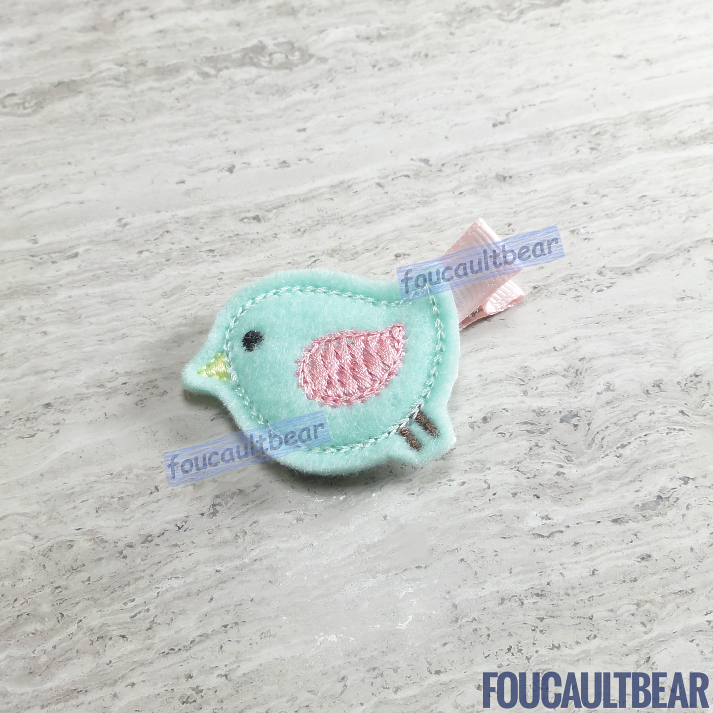 Foucaultbear's HANDMADE HAIR CLIPPIE. Pastel Songbird. Embroidered Soft Felt. Partially Lined Alligator Hair Clip. Super Cute Pastel Songbird Hair Clippie. A nice addition to your little girl's wardrobe. Perfect for toddlers, preschoolers, elementary-schoolers. Absolutely adorable on babies with enough hair to wear it too. Makes for a great baby Shower gift. Definitely not your standard cliché shower gift. Why not be the first to introduce variety to the baby's otherwise boring wardrobe? 