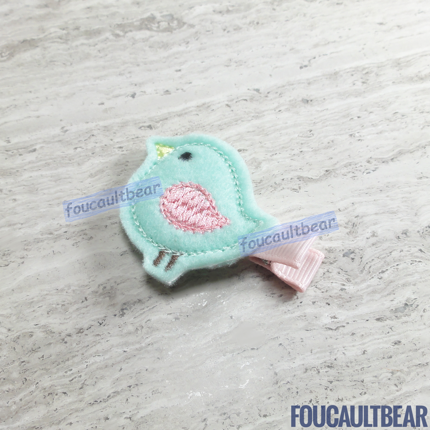 Foucaultbear's HANDMADE HAIR CLIPPIE. Pastel Songbird. Embroidered Soft Felt. Partially Lined Alligator Hair Clip. Super Cute Pastel Songbird Hair Clippie. A nice addition to your little girl's wardrobe. Perfect for toddlers, preschoolers, elementary-schoolers. Absolutely adorable on babies with enough hair to wear it too. Makes for a great baby Shower gift. Definitely not your standard cliché shower gift. Why not be the first to introduce variety to the baby's otherwise boring wardrobe? 