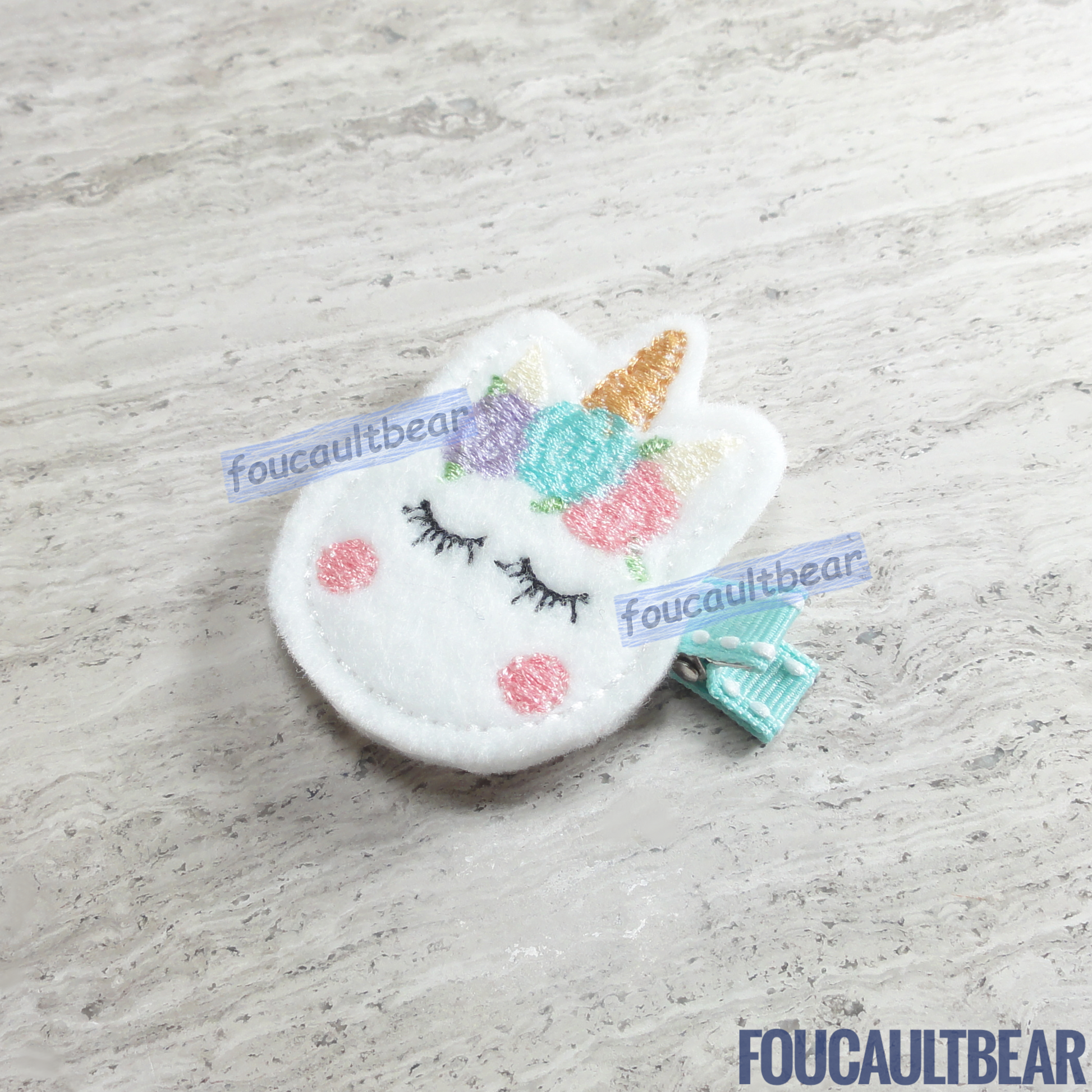 Foucaultbear's HANDMADE HAIR CLIPPIE. Pastel Unicorn. Embroidered Soft Felt. Partially Lined Alligator Hair Clip. Cute Pastel Unicorn Hair Clippie. Every little girl will fall in love with unicorns at some point in their young life. Perfect for toddlers, preschoolers, elementary-schoolers. Absolutely adorable on babies with enough hair to wear to wear it too. Makes for a great baby Shower gift. Definitely not your standard cliché shower gift. Introduce variety to the baby's otherwise boring wardrobe. 