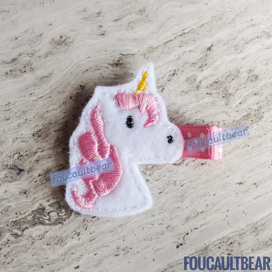 Foucaultbear's  ♦ HANDMADE HAIR CLIPPIE  ♦ Pink Unicorn ♦ Embroidered Soft Felt Centerpiece ♦ Partially Lined Alligator Hair Clip    Cute Pink Unicorn Hair Clippie. Every little girl will fall in love with unicorns at some point in their young life. Perfect for toddlers, preschoolers, elementary-schoolers Absolutely adorable on babies with enough hair to wear to wear it too.  Approximately 1 7/8 inches (4.7 cm) in height.   Attached with a 1 3/4 inch (4.5 cm) partially lined alligator clip. 