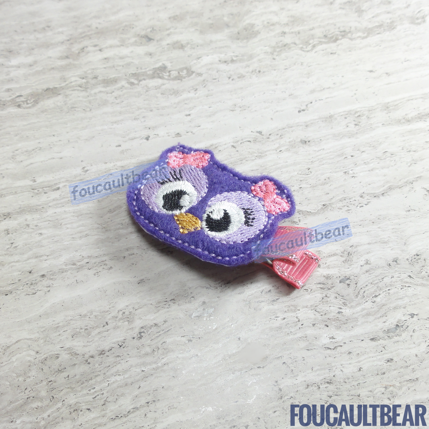 Foucaultbear's HANDMADE HAIR CLIPPIE. Purple Owl. Embroidered Soft Felt Centerpiece. Partially Lined Alligator Hair Clip. Adorable Purple Owl Hair Clippie. Owls are the adoration of many kids and adults! Perfect for toddlers, preschoolers, elementary-schoolers. Absolutely adorable on babies with enough hair to wear to wear it too. Makes for a great baby Shower gift. Definitely not your standard cliché shower gift. Why not be the first to introduce variety to the baby's otherwise boring wardrobe?