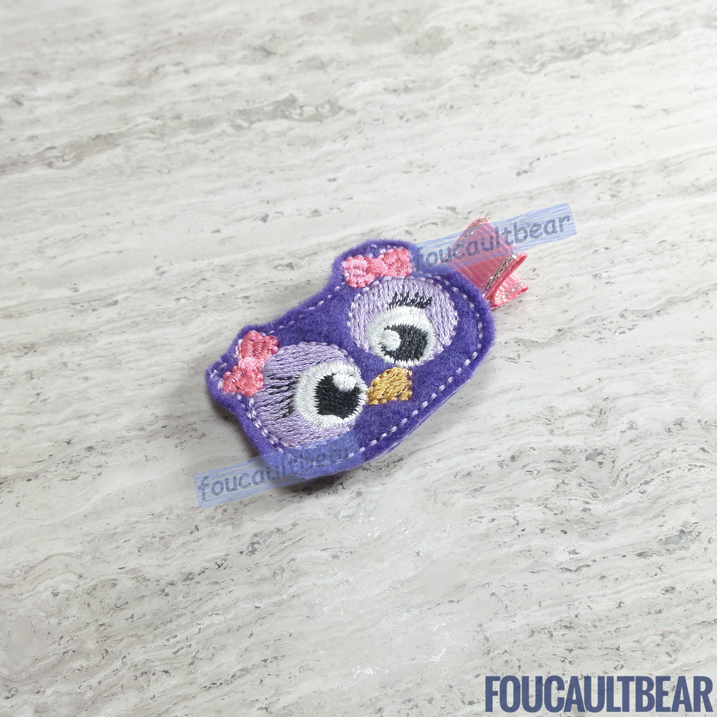 Foucaultbear's HANDMADE HAIR CLIPPIE. Purple Owl. Embroidered Soft Felt Centerpiece. Partially Lined Alligator Hair Clip. Adorable Purple Owl Hair Clippie. Owls are the adoration of many kids and adults! Perfect for toddlers, preschoolers, elementary-schoolers. Absolutely adorable on babies with enough hair to wear to wear it too. Makes for a great baby Shower gift. Definitely not your standard cliché shower gift. Why not be the first to introduce variety to the baby's otherwise boring wardrobe?