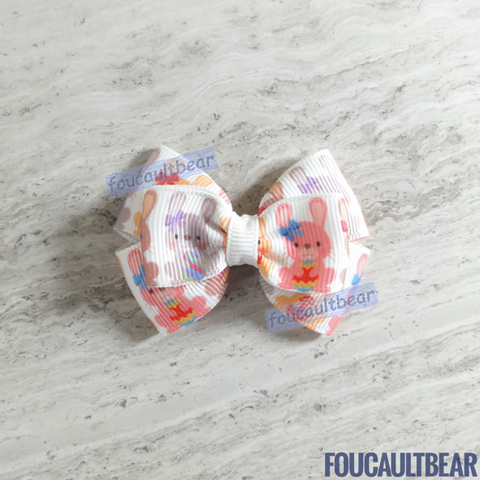 Foucaultbear's HANDMADE HAIR BOW CLIP. Small Little Bunny Rabbits. Grosgrain Ribbon. Partially Lined Alligator Hair Clip. This Sweet Little Bunnies hair bow is perfect for babies, toddlers, preschoolers & kindergartners for Easter and year-round. Very versatile, in my opinion. Approximately 2 3/8 inches (6 cm) in length and 1 3/4 inches (4.5 cm) at its widest. As this bow is handmade to order, please allow very slight variations in measurement. 