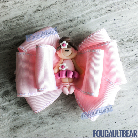 Foucaultbear's HANDMADE MULTI-LAYERED HAIR BOW CLIP with CLAY CENTERPIECE. Pink Ballerina Girl. Handmade Polymer Clay Centerpiece. Grosgrain Ribbon. French Barrette Hair Clip for Ponytail or Pigtails. Adorable Clay Pink Ballerina wearing her Tutu centerpiece adorns this hair bow barrette. Perfect for toddlers, preschoolers, kindergartners, elementary or even middle-schoolers. Ballerinas are a classic year round! Notice the pretty flowers on her hair bun and her dress! 