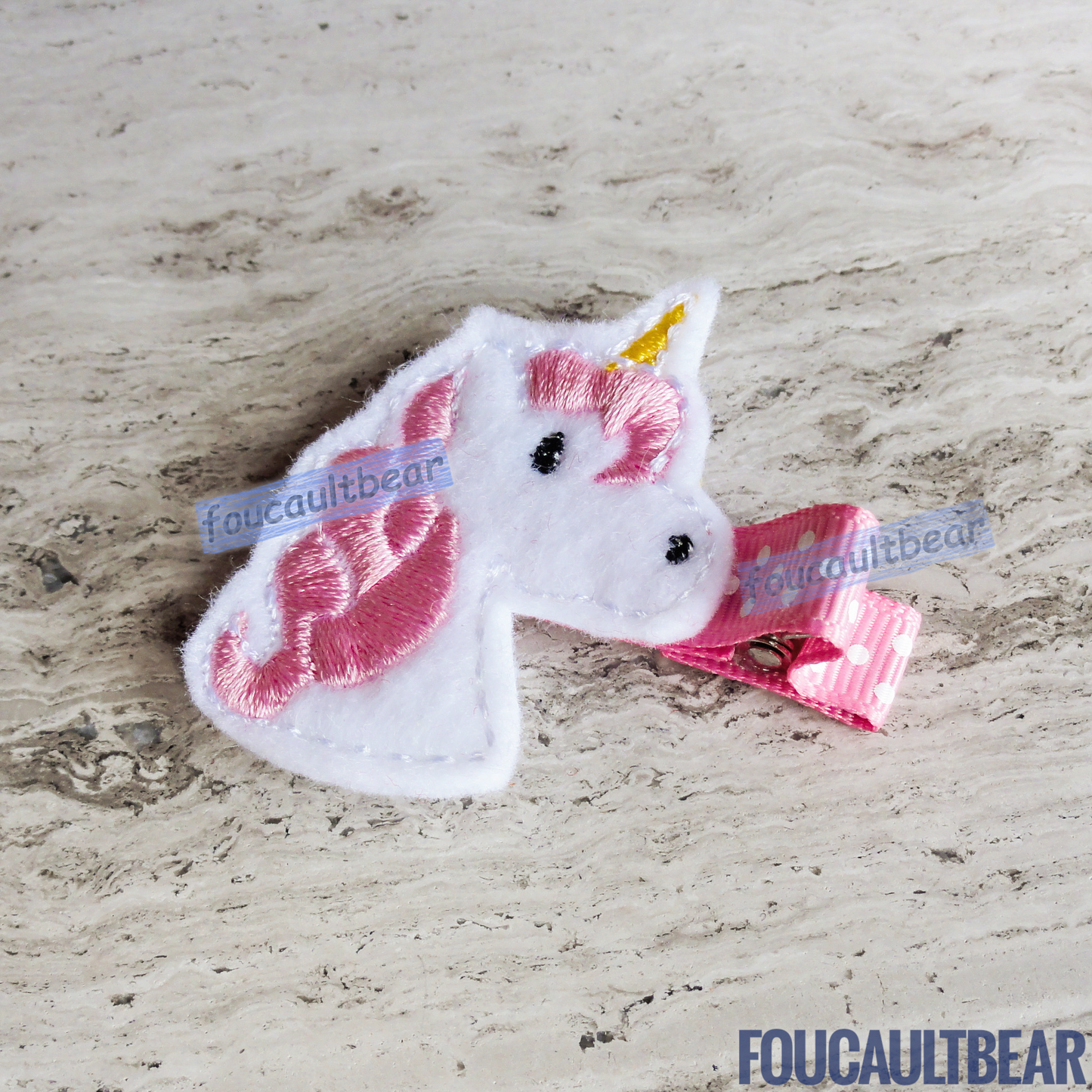 Foucaultbear's  ♦ HANDMADE HAIR CLIPPIE  ♦ Pink Unicorn ♦ Embroidered Soft Felt Centerpiece ♦ Partially Lined Alligator Hair Clip    Cute Pink Unicorn Hair Clippie. Every little girl will fall in love with unicorns at some point in their young life. Perfect for toddlers, preschoolers, elementary-schoolers Absolutely adorable on babies with enough hair to wear to wear it too.  Approximately 1 7/8 inches (4.7 cm) in height.   Attached with a 1 3/4 inch (4.5 cm) partially lined alligator clip. 
