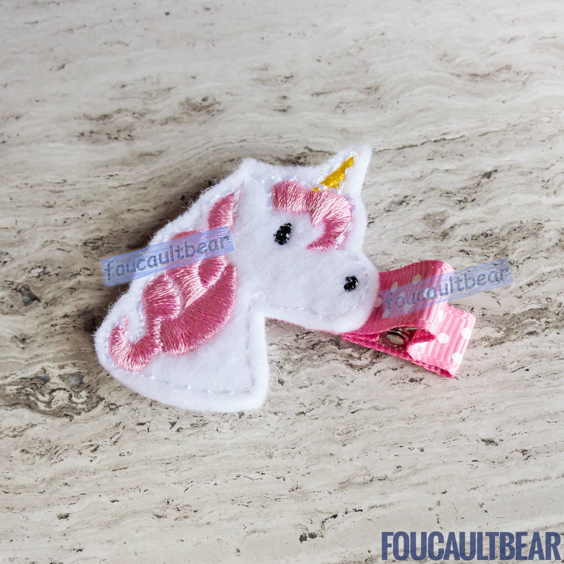 Foucaultbear's  ♦ HANDMADE HAIR CLIPPIE  ♦ Pink Unicorn ♦ Embroidered Soft Felt Centerpiece ♦ Partially Lined Alligator Hair Clip    Cute Pink Unicorn Hair Clippie. Every little girl will fall in love with unicorns at some point in their young life. Perfect for toddlers, preschoolers, elementary-schoolers Absolutely adorable on babies with enough hair to wear to wear it too.  Approximately 1 7/8 inches (4.7 cm) in height.   Attached with a 1 3/4 inch (4.5 cm) partially lined alligator clip. 